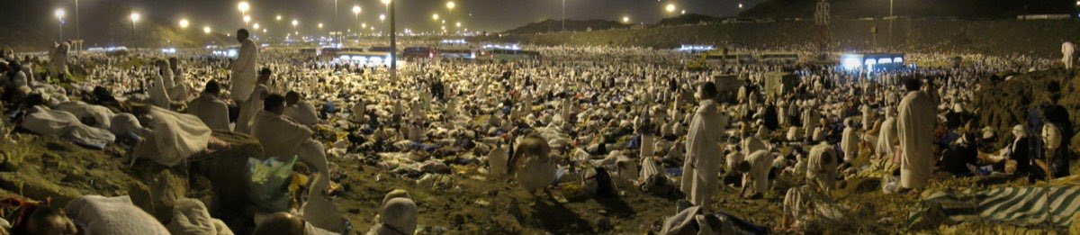 Panorama of the open ground at Muzdalifah, where pilgrims rest under the sky between Arafat and Mina.